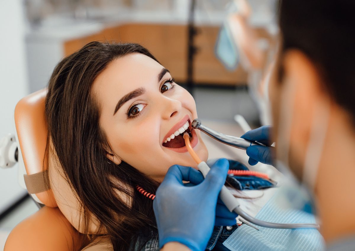 Dentist performing routine dental check-up on patient in Sunshine Coast clinic